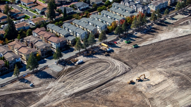 A construction site is seen next to houses in this aerial photograph taken near Cupertino, California, U.S., on Wednesday, Oct. 23, 2019. Facebook Inc. is following other tech titans like Microsoft Corp. and Google, pledging to use its deep pockets to ease the affordable housing shortage in West Coast cities. The social media giant said that it would commit $1 billion over the next decade to address the crisis in the San Francisco Bay Area. Photographer: Sam Hall/Bloomberg