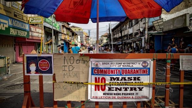 MANILA, PHILIPPINES - APRIL 23: Customers sit on chairs spaced to enforce social distancing as they queue outside a wet market on April 23, 2020 in Manila, Philippines. The Philippines' main island Luzon, which includes the capital Manila, remains on lockdown as authorities continue to struggle with the growing number of COVID-19 cases. Land, sea, and air travels have been suspended, while government work, schools, businesses, and public transportation have been ordered to shutdown in a bid to keep some 55 million people at home. The Philippines' Department of Health has so far confirmed 6,981 cases of the coronavirus in the country, with at least 462 recorded fatalities. (Photo by Ezra Acayan/Getty Images)