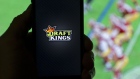 The DraftKings Inc. logo is arranged for a photograph on an Apple Inc. iPhone in Washington, D.C., U.S., on Sunday, Oct. 4, 2015.