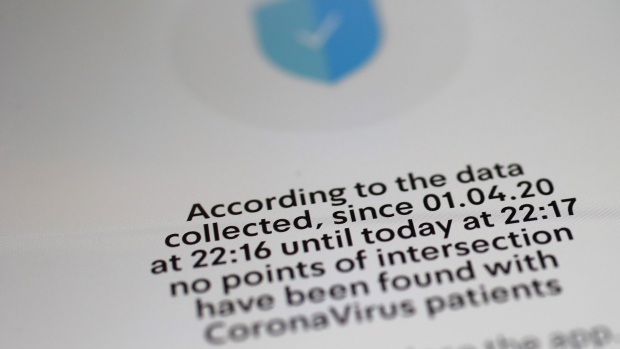 A smartphone screen displays information from the Israel Ministry of Health Hamagen coronavirus symptom tracker app in an arranged photograph taken in Bern, Switzerland, on Wednesday, April 1, 2020. The Covid-19 pandemic has triggered a seismic wave of health awareness and anxiety, which is energizing a new category of virus-fighting tech and apps. Photographer: Stefan Wermuth/Bloomberg