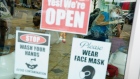 Face mask and hand washing signs are displayed on the door of a nail salon in Atlanta, Georgia, U.S., on Friday, April 24, 2020. Georgia's hair salons, tattoo parlors, bowling alleys, and other nonessential businesses were permitted to reopen on Friday, after Governor Brian Kemp announced earlier this week that he'd ease the state's stay-at-home order. Photographer: Elijah Nouvelage/Bloomberg