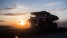 The sun sets over a dump truck operating at the Tavan Tolgoi coal deposit developed by Erdenes Tavan Tolgoi JSC, a unit of Erdenes Mongol LLC, during sunset in Tsogtsetsii, Ömnögovi Province, Mongolia, on Monday, Sept. 24, 2018. 