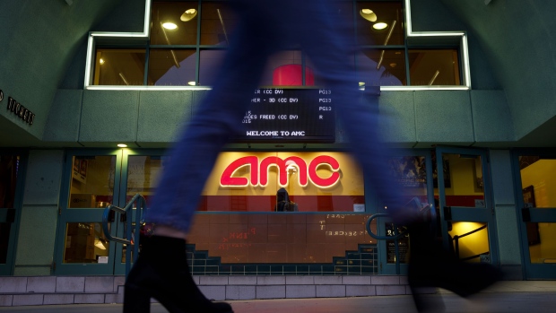 A pedestrians passes in front of an AMC Entertainment Inc. movie theater in Santa Monica, California, U.S., on Tuesday, Feb. 27, 2018. AMC Entertainment is scheduled to release earnings figures on March 1. Photographer: Patrick T. Fallon/Bloomberg