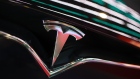 The Tesla Inc. logo is seen on the grille of a Model X electric vehicle at the Moscow Tesla Club in Moscow, Russia, on Friday, July 20, 2018. Tesla may nearly double the number of cars it’s selling in Russia after a mobile-phone retailer backed by billionaire Alisher Usmanov unexpectedly added electric vehicles to the line of gadgets it offers. MegaFon PJSC, said it received orders for 236 vehicles in June, the first month it started sales jointly with importer Moscow Tesla Club. Photographer: Andrey Rudakov/Bloomberg