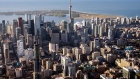 The CN Tower stands among buildings in the downtown skyline in this aerial photograph taken above Toronto