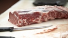 A piece of beef sit on a cutting surface in the meat department of a supermarket in Princeton, Illinois, U.S., on Thursday, April 16, 2020. The Trump administration would like to make purchases of milk and meat products as part of a $15.5 billion initial aid package to farmers rattled by the coronavirus, said Agriculture Secretary Sonny Perdue. Photographer: Daniel Acker/Bloomberg