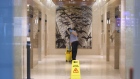 A worker cleans an office tower lobby in Toronto, Ontario, Canada, on Wednesday, March 25, 2020.