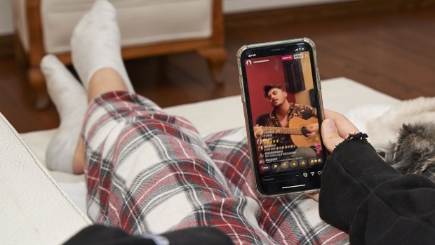 MADRID, SPAIN - MARCH 13: In this photo illustration, A teenager watches Sienna's online concert at her home following the recommendation of staying at home to fight COVID-19 on March 13, 2020 in Madrid, Spain. '#yomequedoencasa' is a streaming music festival promoted by more than 40 Spanish artist to entertain people who has to stay at home due to COVID-19. (Photo Illustration by Carlos Alvarez/Getty Images)