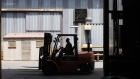 A worker drives a forklift by the warehouse at the MIS Engineering Mitak foundry in Johannesburg, South Africa, on Wednesday, March 4, 2020. South African business sentiment plunged to the lowest level in more than two decades in the first quarter and could weaken even further as the coronavirus hits the domestic and global economy. Photographer: Guillem Sartorio/Bloomberg