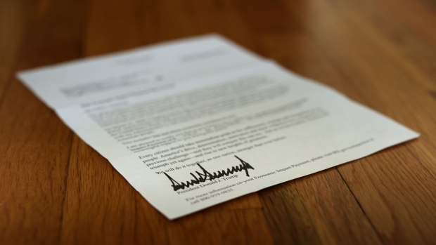 WASHINGTON, DC - APRIL 29: A letter bearing the signature of U.S. President Donald Trump was sent to people who received a coronavirus economic stimulus payment as part of the Cares Act April 29, 2020 in Washington, DC. The letter had a return address for the Internal Revenue Service in Austin, Texas, but was printed on White House letterhead. The initial 88 million payments totaling nearly $158 billion were sent by the Treasury Department last week as most of the country remains under stay-at-home orders due to the COVID-19 pandemic. (Photo by Chip Somodevilla/Getty Images)