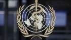 The World Health Organization (WHO) emblem sits on a glass entrance door at the WHO headquarters in Geneva, Switzerland, on Tuesday, Feb. 18, 2020. 
