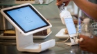 A customer inserts a credit card into Square Inc. device. Bloomberg
