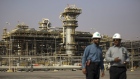 Employees visit the Natural Gas Liquids facility in Saudi Aramco's Shaybah oilfield in the Rub' Al-Khali (Empty Quarter) desert in Shaybah, Saudi Arabia. Photographer: Simon Dawson/Bloomberg