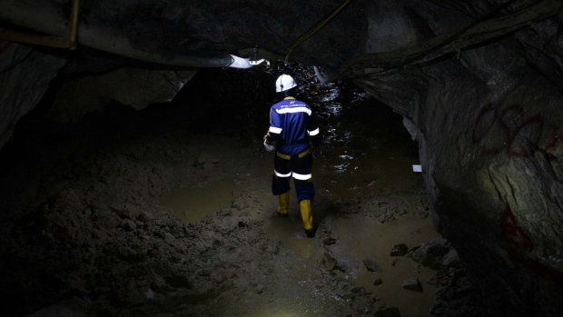 A worker walks through mud inside the Gran Colombia Gold Corp. mine in Segovia, Colombia, on Monday, Jan. 27, 2020. The Canadian-based Gran Colombia produced nearly 240,000 ounces of gold through 2019, up 10% from 2018. Photographer: Nicolo Filippo Rosso/Bloomberg