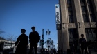 Pedestrians pass in front of Twitter headquarters in San Francisco on Feb. 8. Photographer: David Paul Morris/Bloomberg