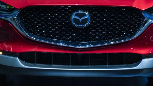 The Mazda Motor Corp. 2020 CX-30 sports utility vehicle (SUV) is displayed during a reveal event during AutoMobility LA ahead of the Los Angeles Auto Show in Los Angeles, California, U.S., on Wednesday, Nov. 20, 2019. Engines are taking a back seat to motors at this year's Los Angeles Auto Show as carmakers showcase the latest electric additions to their vehicle lineups. Photographer: Kyle Grillot/Bloomberg