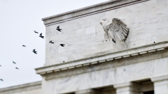 Birds fly past the Marriner S. Eccles Federal Reserve Board building in Washington, D.C. Photographer: Joshua Roberts/Bloomberg