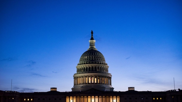 The U.S. Capitol stands illuminated at night in Washington, D.C., U.S., on Monday, May 4, 2020. Lawmakers are preparing for a debate on whether the U.S. economy will need a long-term effort to rebuild it, something that could cost trillions of dollars. Photographer: Al Drago/Bloomberg
