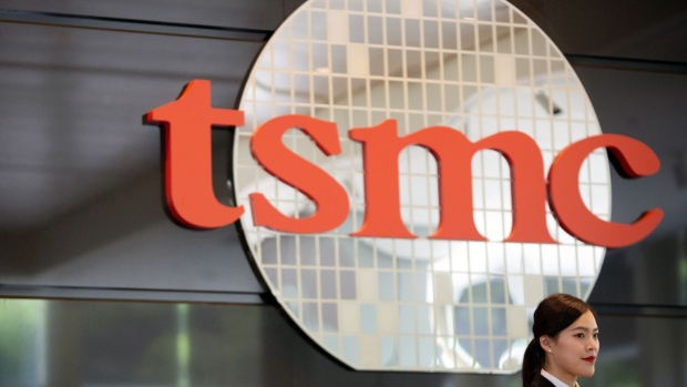 Signage for Taiwan Semiconductor Manufacturing Co. (TSMC) is displayed at the company's headquarters in Hsinchu, Taiwan, on Wednesday, June 5, 2019. TSMC Chairman Mark Liu didn't reaffirm a previous forecast that the company will grow slightly in 2019, saying uncertainty was too great at the moment. Photographer: Ashley Pon/Bloomberg