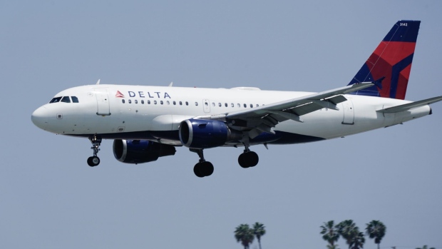 An Airbus SE A310-114 aircraft, operated by Delta Air Lines Inc., flies into San Diego International Airport (SAN) in San Diego, California, U.S., on Monday, April 27, 2020. U.S. airlines reached preliminary deals to access billions of dollars in federal aid, securing a temporary lifeline as the industry waits for customers to start flying again. Photographer: Bing Guan/Bloomberg