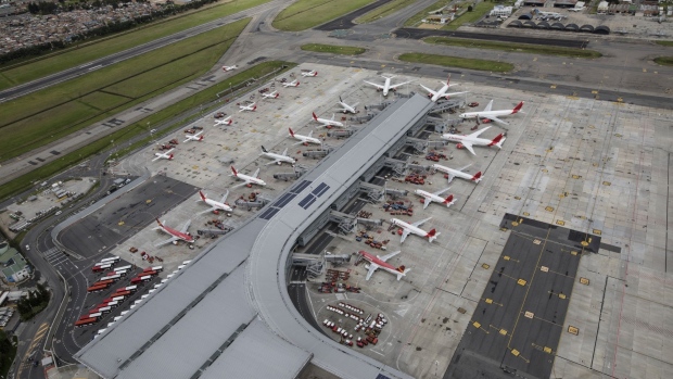Airplanes sit parked at El Dorado International Airport in Bogota on April 7. Photographer: Ivan Valencia/Bloomberg