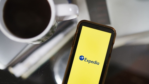 The logo for Expedia Group Inc. is displayed on a laptop computer in an arranged photograph taken in the Brooklyn borough of New York, U.S., on Monday, May 11, 2020. In a matter of months, the coronavirus reset the clock on a decades-long aviation boom that's been one of the great cultural and economic phenomena of the postwar world. Photographer: Gabby Jones/Bloomberg