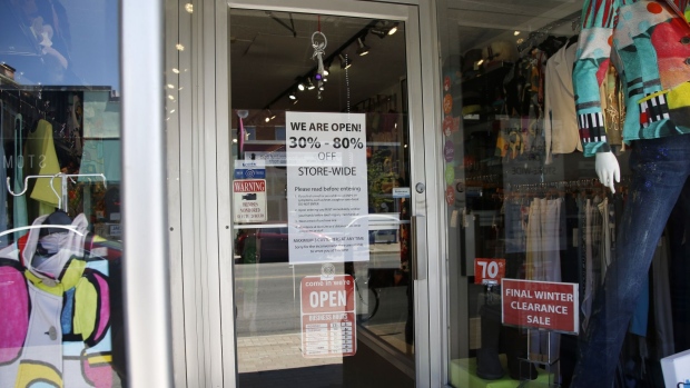 Rules are displayed in the window of a clothing store in Ottawa, Ontario, Canada, on Wednesday, May 20, 2020. Ontario has allowed the reopening of most stores, except for those in shopping malls. Photographer: David Kawai/Bloomberg