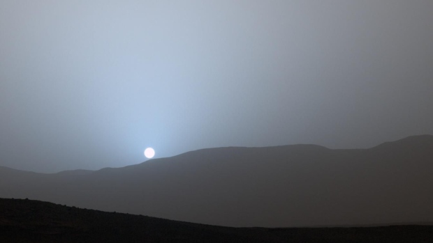 GALE CRATER, MARS - APRIL 10, 2015: In this handout provided by NASA/JPL-Caltech/MSSS, NASA's Curiosity Mars rover recorded this view of the sun setting at the close of the mission's 956th Martian day, or sol April 15, 2015, from the rover's location in Gale Crater, Mars. (Photo by NASA/JPL-Caltech/MSSS/Texas A&M Univ via Getty Images)