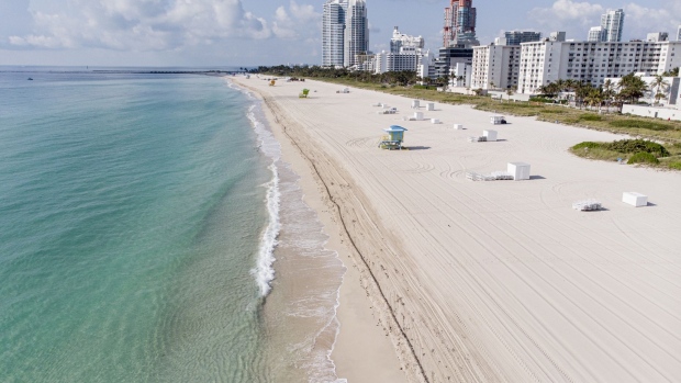 A closed South Beach in Miami on April 8. Photographer: Marco Bello/Bloomberg