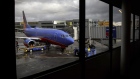 A Southwest aircraft stands on the tarmac at San Francisco International Airport. Photographer: Patrick T. Fallon/Bloomberg