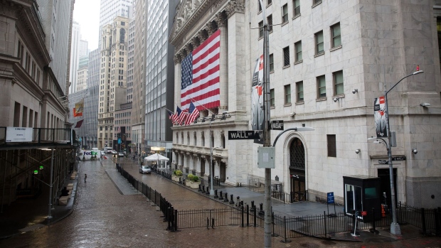 Rain falls over the New York Stock Exchange (NYSE) in New York, U.S., on Tuesday, April 21, 2020. Treasury futures ended Tuesday mixed, with front-end yields slightly cheaper on the day and rest of the curve richer, yet off session lows reached during U.S. morning. Photographer: Michael Nagle/Bloomberg