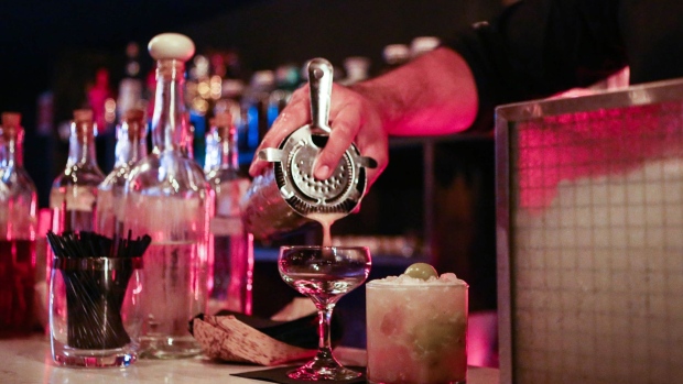 A bartender pours a baijiu-based cocktail at Bar Lumos, which serves 40 different brands of baijiu, in New York, U.S., on Tuesday, Sept. 27, 2016. With less than 1 percent of baijiu consumed abroad, Chinese distillers want to transform the fiery Chinese grain liquor into "the new tequila" for Americans and Europeans. Photographer: Christopher Goodney/Bloomberg