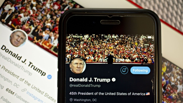 The Twitter profile of U.S. President Donald Trump is displayed on a smartphone and tablet computer in this arranged photograph taken in Arlington, Virginia, U.S., on Tuesday, Oct. 1, 2019. Trump on Twitter today blamed Federal Reserve Chairman Jerome Powell and his colleagues at the central bank for hurting manufacturing companies after a key gauge of the industry's health posted its weakest reading since the end of the last recession. Photographer: Andrew Harrer/Bloomberg