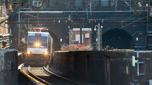 A New Jersey Transit Corp. train exits the North River Tunnels, a pair of tunnels that carry Amtrak and New Jersey Transit trains under the Hudson River in North Bergen, New Jersey, U.S., on Wednesday, March 13, 2019. Amtrak, along with three New York City-area mass-transit agencies and two members of the U.S. House of Representatives, say there is no known alternative plan should the Hudson River tunnel close, cutting off the national railroad's busiest route and blocking thousands from their workplaces. Photographer: Ron Antonelli/Bloomberg
