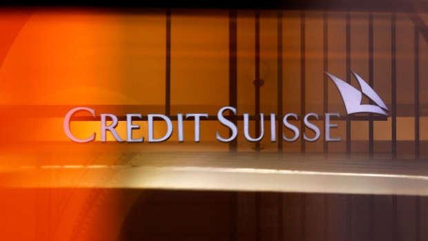 A logo hangs in the entrance to Credit Suisse Group AG's headquarters in Zurich, Switzerland, on Wednesday, July 31, 2019. Credit Suisse brushed off the gloom in European bank earnings as wealthy clients added new money and revenue from securities trading rose in a quarter in which peers posted declines. Photographer: Stefan Wermuth/Bloomberg