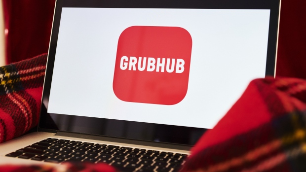 The logo for the Grubhub Inc. application is displayed on an Apple Inc. laptop computer in an arranged photograph taken in the Brooklyn borough of New York, U.S., on Friday, April 10, 2020. Grubhub, the parent of food delivery app Seamless, said last month it was deferring fees for independent restaurants using the service in response to the coronavirus pandemic. Photographer: Gabby Jones/Bloomberg