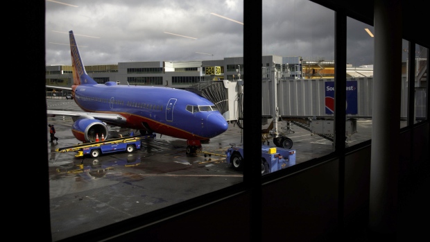 A Southwest aircraft stands on the tarmac at San Francisco International Airport. Photographer: Patrick T. Fallon/Bloomberg