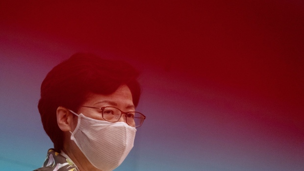 Carrie Lam, Hong Kong's chief executive, speaks while wearing a protective mask during a news conference in Hong Kong, China, on Tuesday, June 2, 2020. Hong Kong's leader said there was "no justification whatsoever" for foreign governments to place sanctions on the city, after the Trump administration moved to rescind the special trading status that distinguishes the financial hub from the mainland. Photographer: Roy Liu/Bloomberg