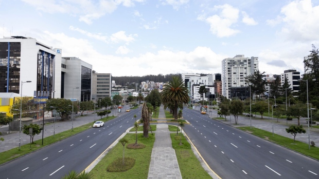 Vehicles travel along the near deserted Avenida Naciones Unidas in Quito, Ecuador, on Friday, March 20, 2020. Ecuador moved their curfew times up on March 18 to fight the swift spread of the coronavirus, following a spike in cases in the Guayas province after people disobeyed orders to self-quarantine. Photographer: Ana Maria Buitron/Bloomberg