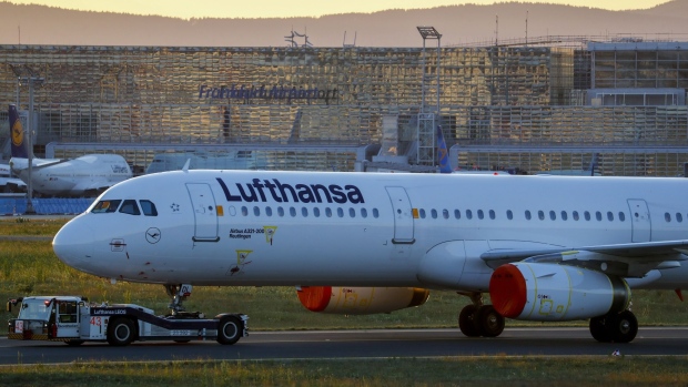A Deutsche Lufthansa AG passenger aircraft is towed at Frankfurt Airport, operated by Fraport AG, in Frankfurt, Germany, on Thursday, May 28, 2020. The German government bristled at the European Commission’s antitrust demands on its 9 billion-euro ($9.9 billion) bailout of Deutsche Lufthansa AG, in a sign of rising tensions over the stalled aid package. Photographer: Alex Kraus/Bloomberg