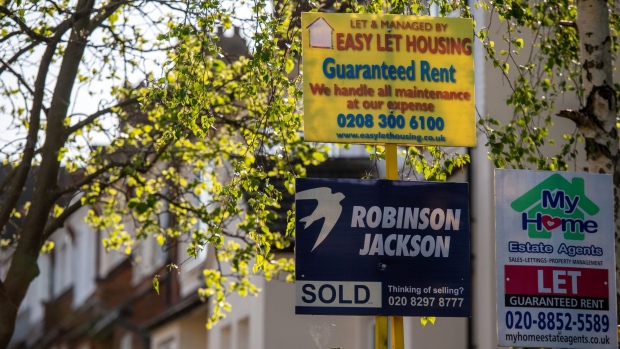 Estate agents Sold and Let signs stand outside a residential property in London, U.K., on Tuesday, April 21, 2020. U.K. real estate agents called for help from the government as expectations for prices and market activity plunged. Photographer: Chris J. Ratcliffe/Bloomberg