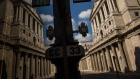 A window reflects the Bank of England (BOE) in the City of London, U.K., on Wednesday, May 6, 2020. Bank of England policy makers will meet this week knowing that they'll probably have to do more to combat the U.K.’s economic slump, if not now then soon. Photographer: Simon Dawson/Bloomberg