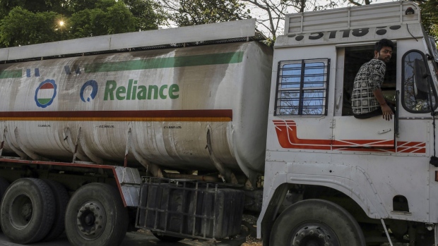 A Reliance Industries oil tanker trucks sit parked near Jawaharlal Nehru Port. Photographer: Dhiraj Singh/Bloomberg