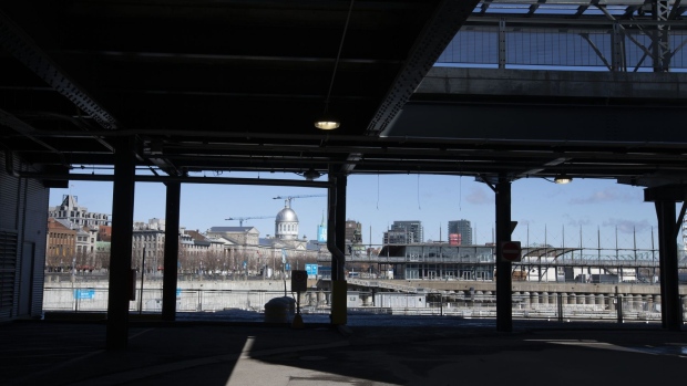The Old Port of Montreal is seen through an empty parking garage in Montreal, Quebec, Canada, on Friday, March 27, 2020. Quebec Premier Francois Legault said he’s putting Quebec “on pause” to limit the coronavirus outbreak and stem physical contact. Photographer: Christinne Muschi/Bloomberg