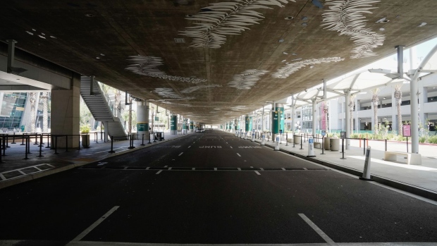Sublimare, an artwork depicting giant kelp by Merge Conceptual Design, is seen above an empty roadway San Diego International Airport (SAN) in San Diego, California, U.S., on Monday, April 27, 2020. U.S. airlines reached preliminary deals to access billions of dollars in federal aid, securing a temporary lifeline as the industry waits for customers to start flying again. Photographer: Bing Guan/Bloomberg