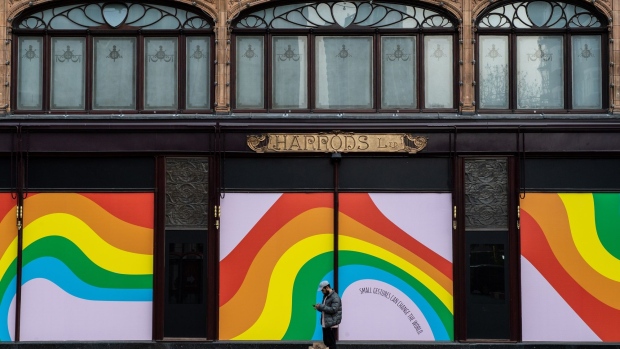 A man stands outside Harrods as it sits closed in London, on April 16. Photographer: Chris J Ratcliffe/Getty Images Europe
