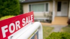 A real estate sign is pictured in Vancouver, B.C., Tuesday, June, 12, 2018. 