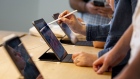 Attendees use a drawing program on an iPad tablet during the opening of the new Apple Inc. Carnegie Library store at Mount Vernon Square in Washington, D.C. Photographer: Anna Moneymaker/Bloomberg