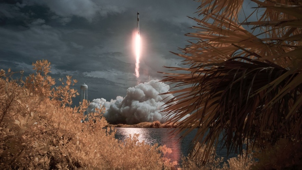 The SpaceX Falcon 9 as it launches from NASA’s Kennedy Space Center in Florida in this false color infrared exposure on May 30. Photographer: Bill Ingalls/Getty Images