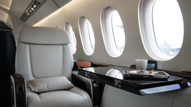 The interior of a mock-up Dassault Aviation SA Falcon 6X private jet is displayed during the Singapore Airshow at the Changi Exhibition Centre in Singapore, on Tuesday, Feb. 11, 2020. Planemakers and airlines are exploring new designs to reduce fuel burn and cut carbon emissions in a warming climate. Blending the wings with the fuselage to cut drag is one of several possible solutions. Photographer: SeongJoon Cho/Bloomberg